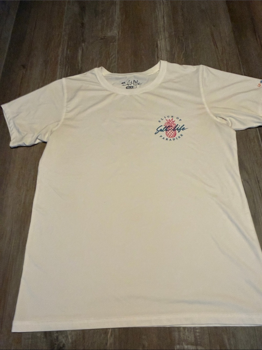 Salt Life SLX t-shirt features a "Slice of Paradise" pineapple graphic